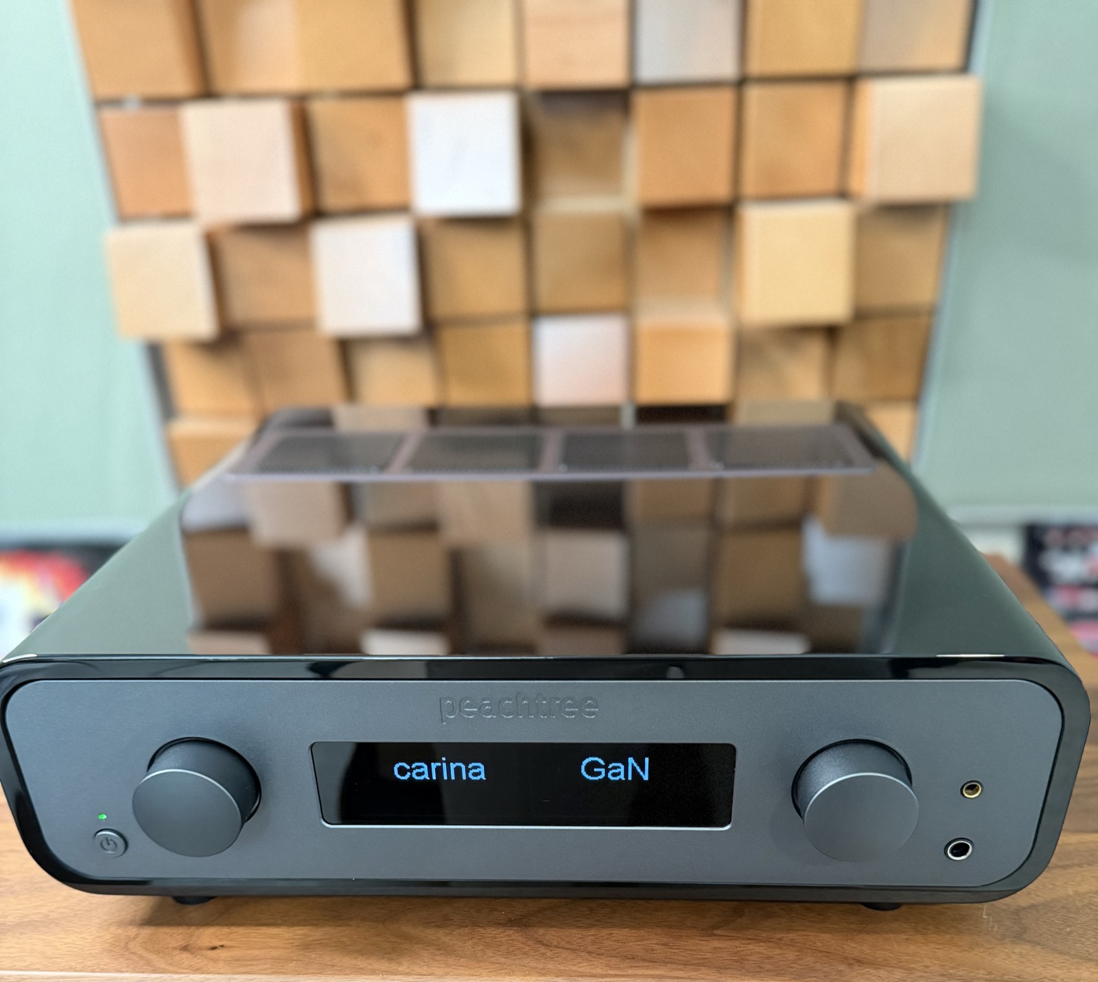 Peachtree Audio Carina GaN — satin charcoal faceplate with OLED display, gloss black chassis